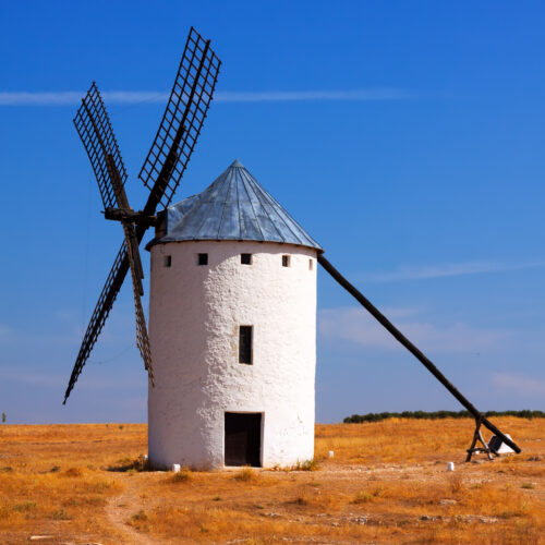 Retro windmill in field